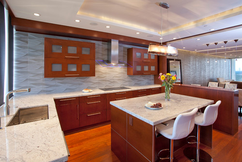 Bianco Romano Granite Countertop, Bianco Romano Overhang Island Top, Cognac Stained Maple Cabinets, Ambra Waves Ceramic Backsplash, Stainless Steel and Glass Vent Hood, Kitchen Pendant, Kitchen Recess Light and Red Oak Flooring